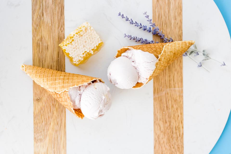 Lavender honey ice cream in waffle cones with honeycomb and lavender