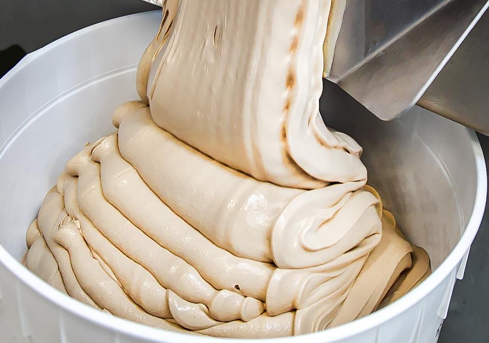 Vanilla ice cream base in a mixing bucket